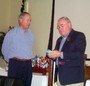 President Mahlon Whittle presents clock gift to PDG Mark von Hoetzendorff